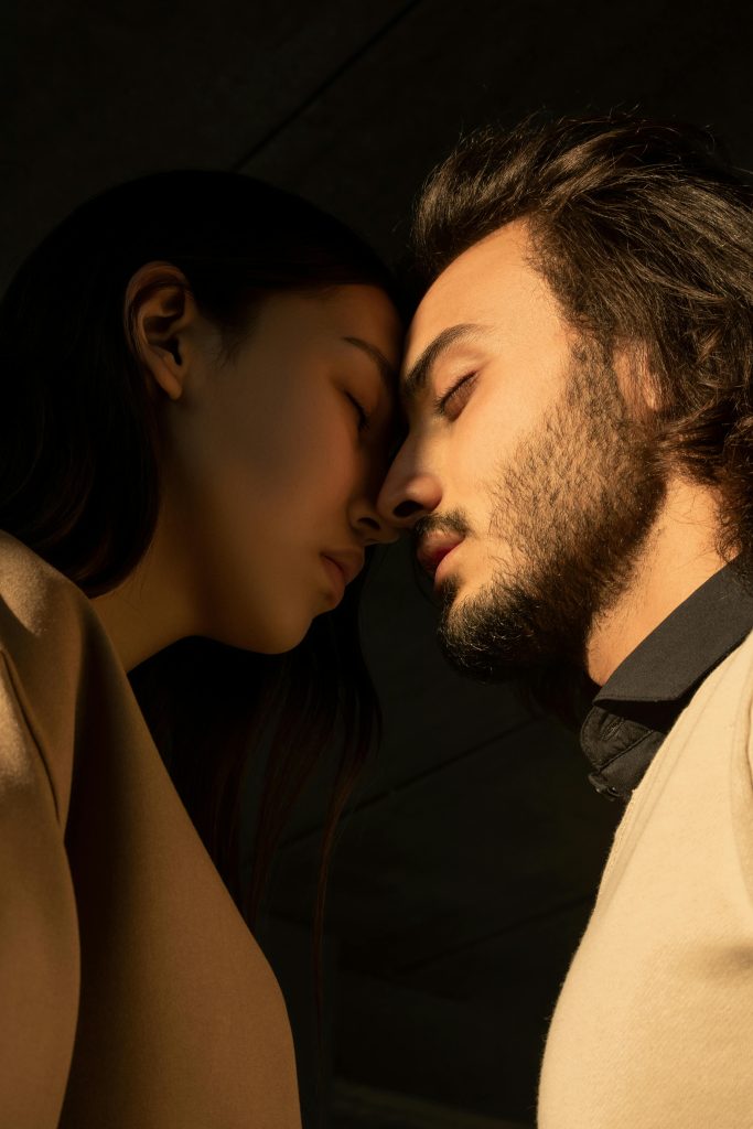 pexels photo 3754270 3754270 Side view of a couple sharing an intimate moment with closed eyes under soft lighting.